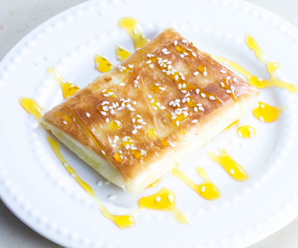 Phyllo Wrapped Feta with Honey and Sesame Seeds. This is a perfect Greek appetizer that will melt in your mouth.